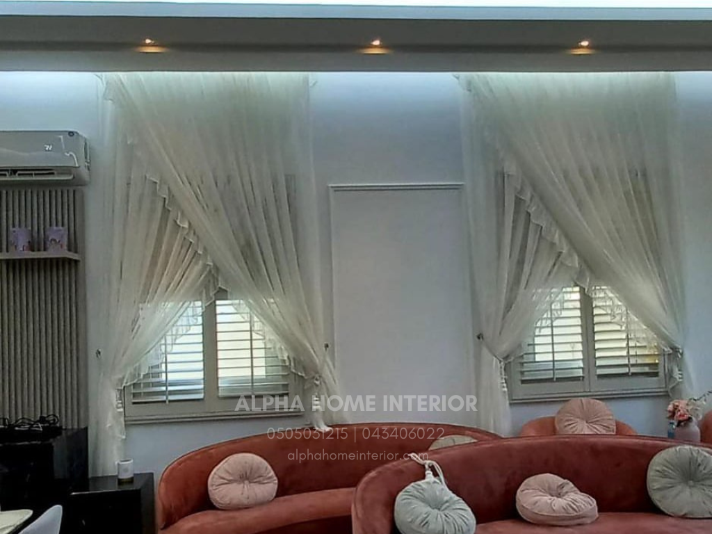 One timeless window treatment is layering curtains over plantation shutters !